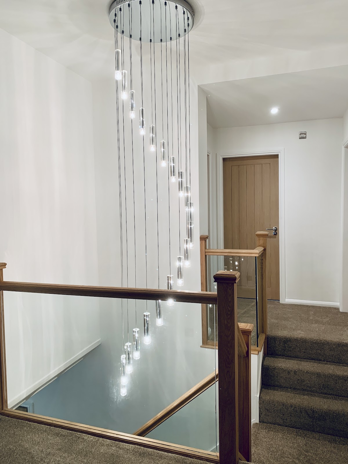 Oak and glass bannister fitted on a landing in Sunderland
